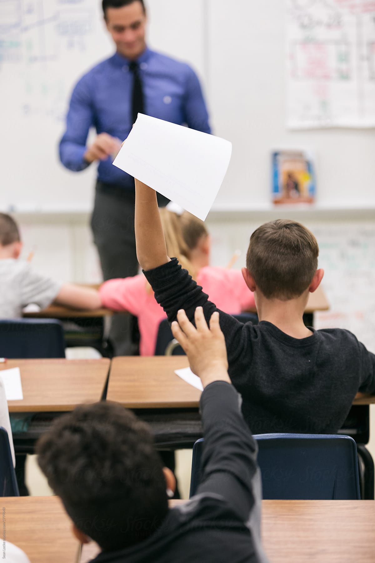 Classroom: Student Hands Back Paper