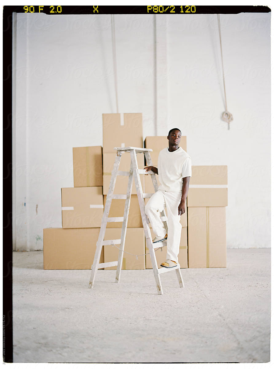 Storehouse worker on ladder