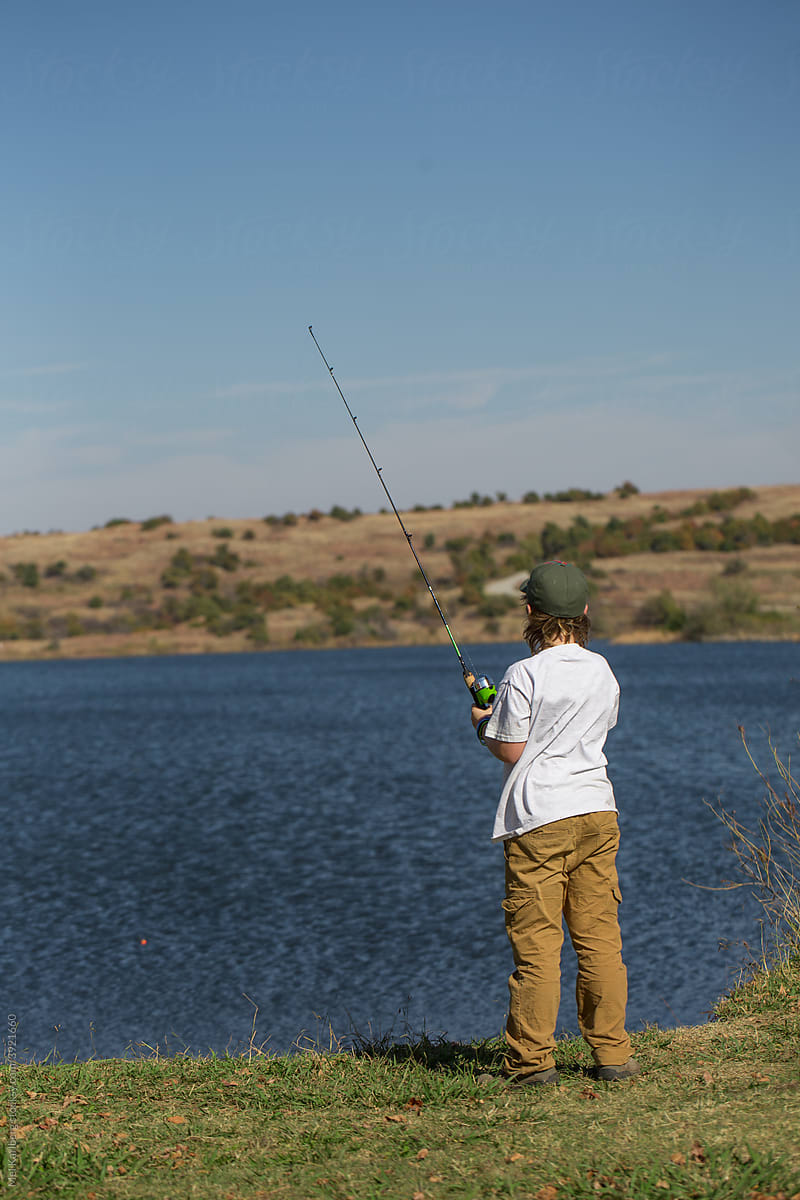 Young boy fishing on a lake