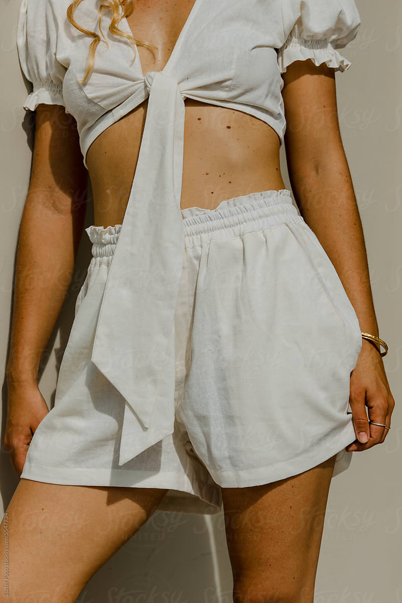 Female body detail wearing organic linen outfit
