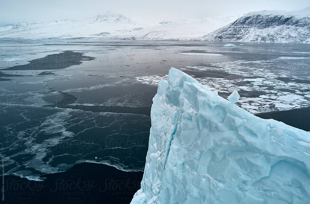 Greenland Arctic iceberg winter - beautiful large berg of ice, aerial