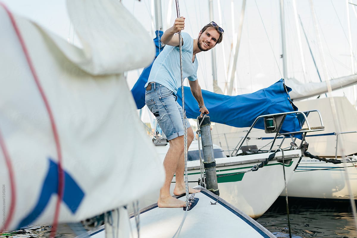 Man getting boat ready for Sailing