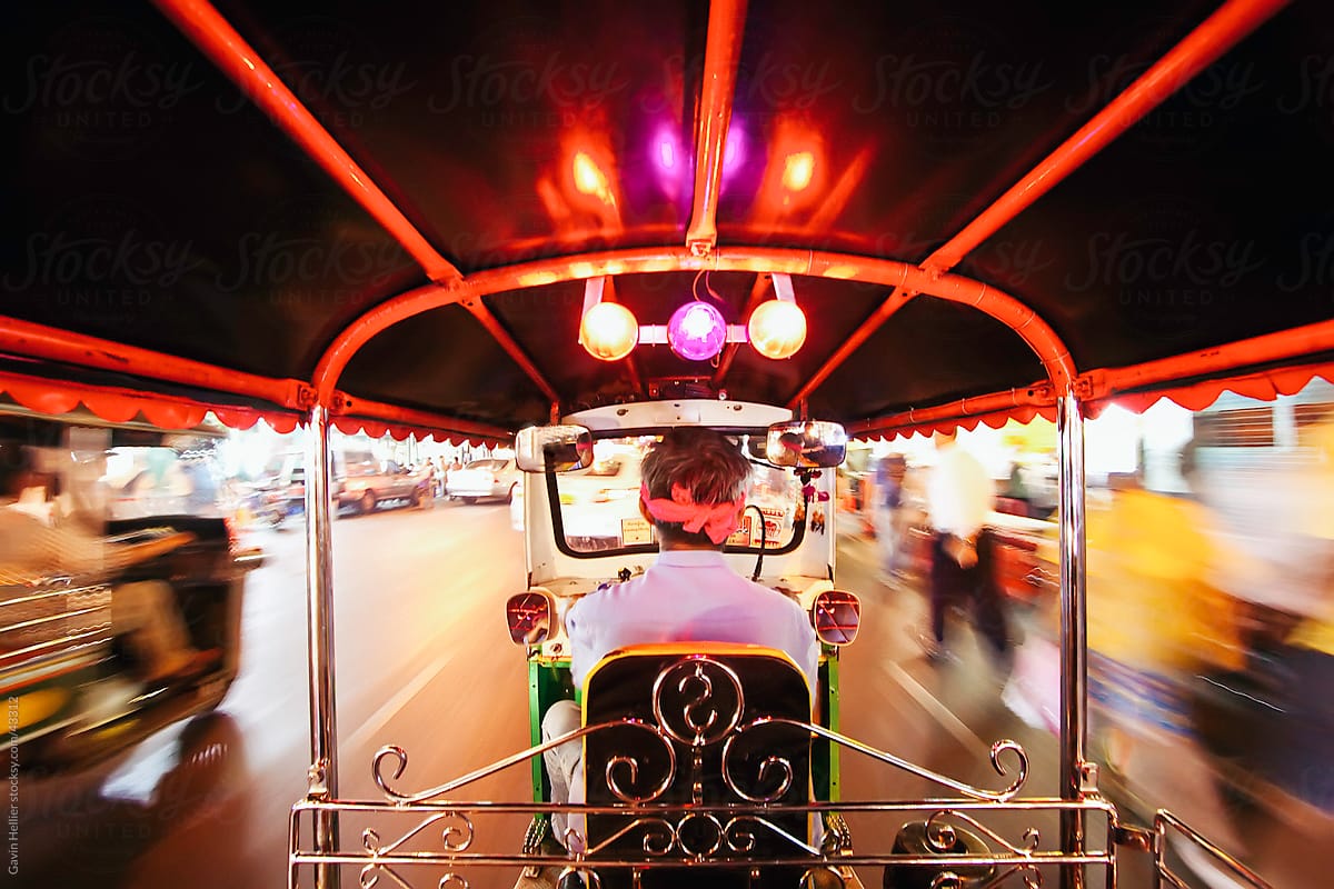 Tuk Tuk or auto rickshaw in motion at night, Bangkok, Thailand, South East Asia