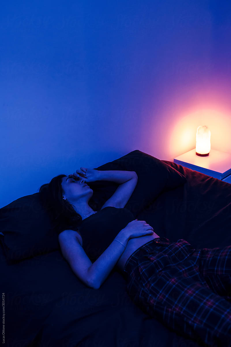 Woman in blue bedroom