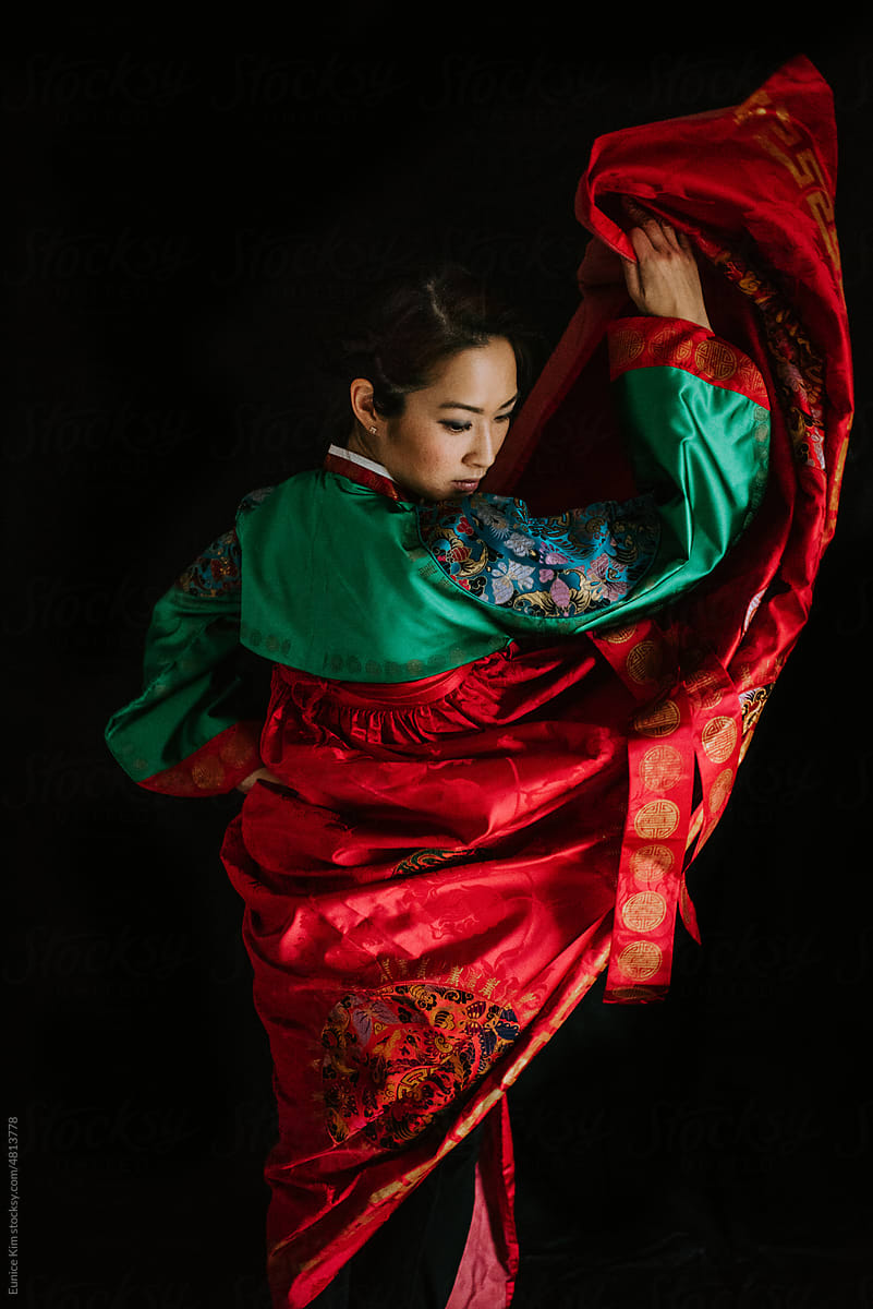 An Asian Woman in a Traditional Dress