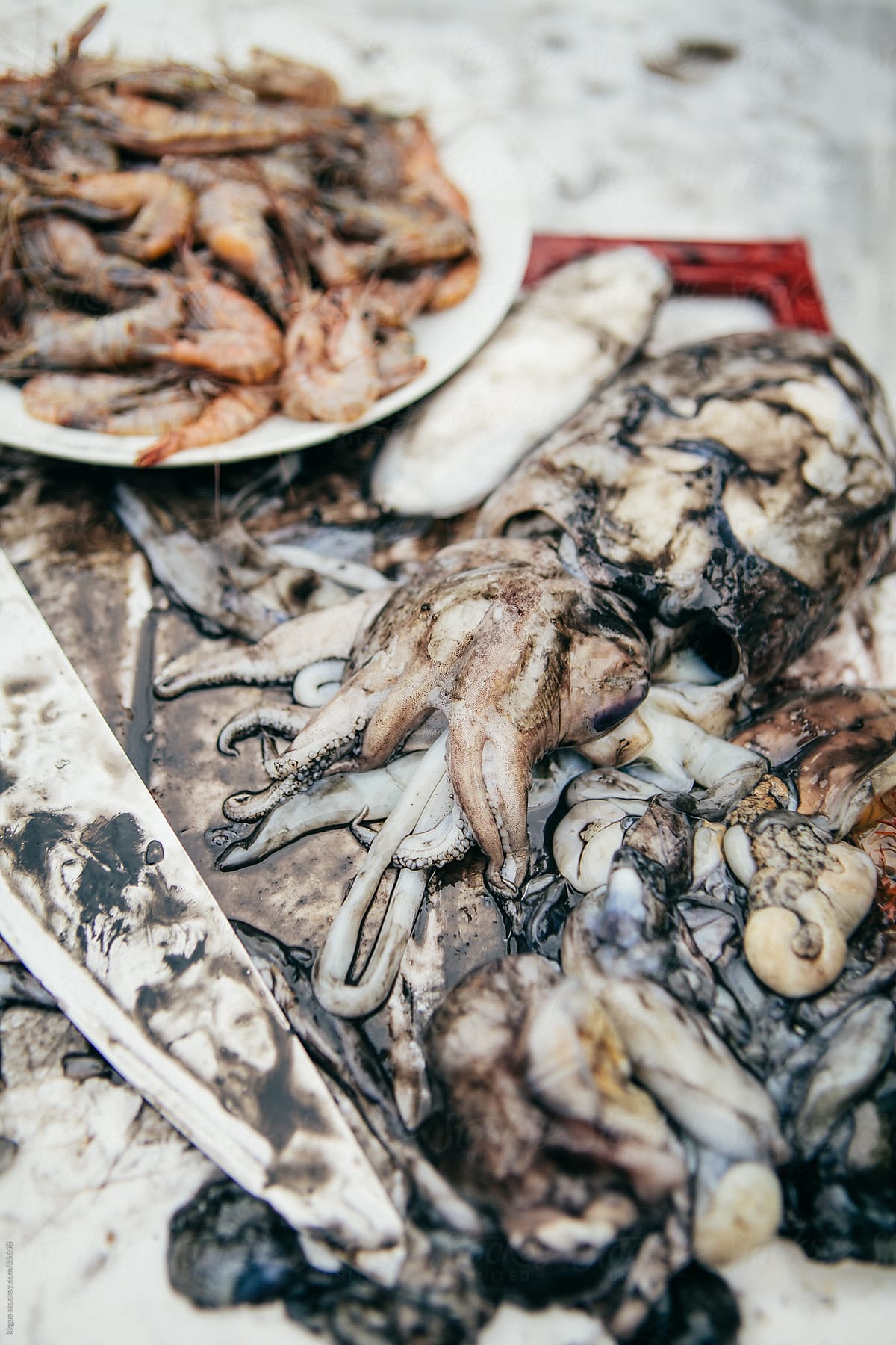 Cuttlefish and prawns in the process of being prepared for cooking