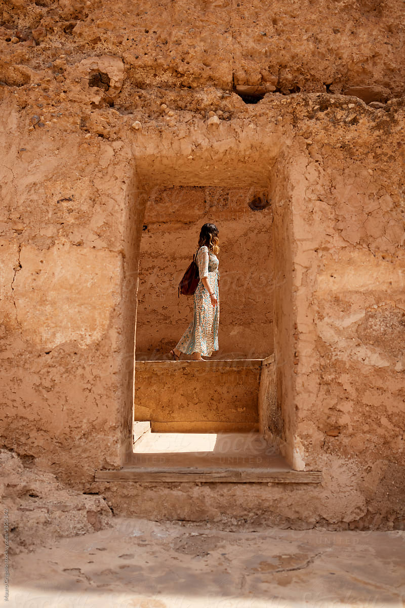Female tourist visiting a building in Marrakech, Morocco