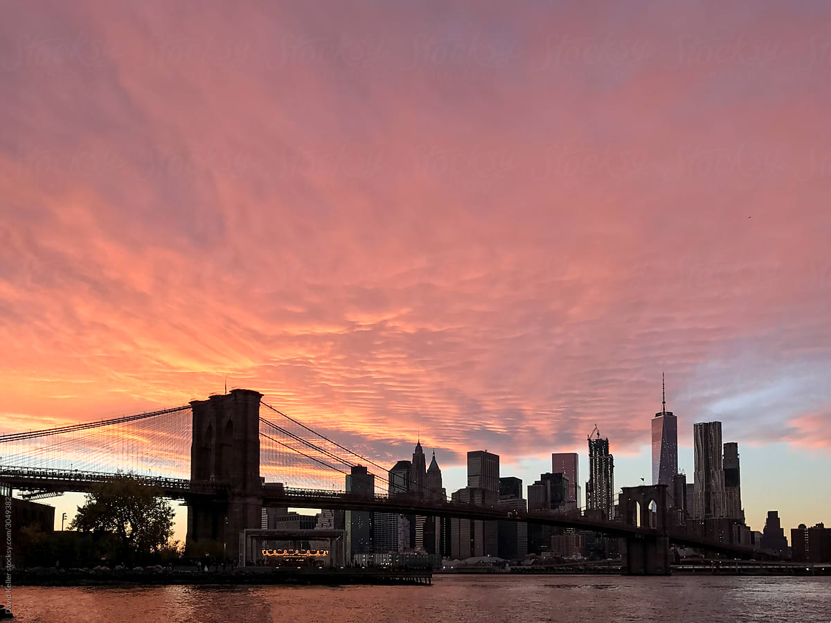 A vibrant sunset view of the New York skyline