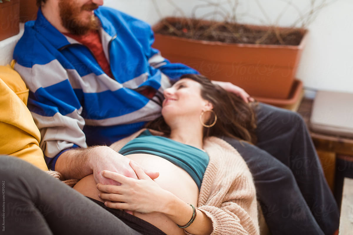 Relaxed couple enjoying pregnancy