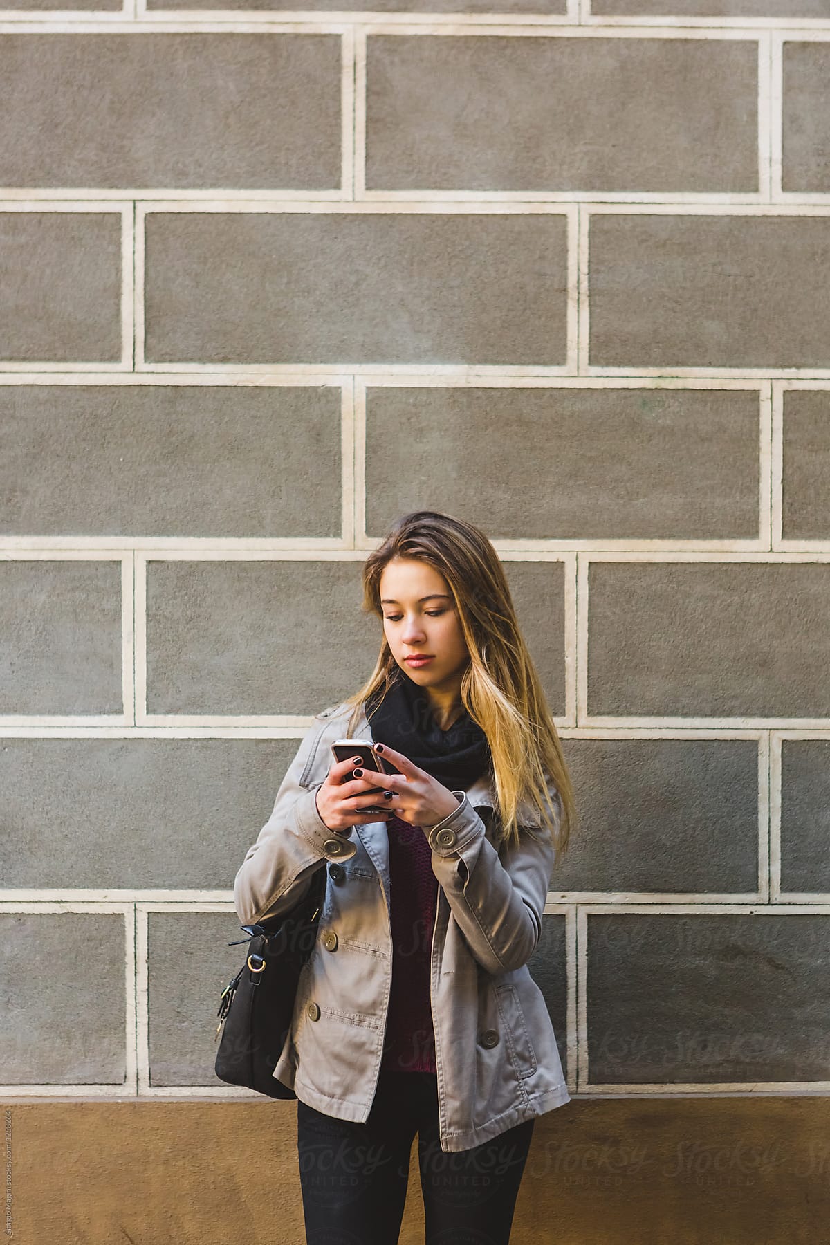 Teenage Girl in Urban Area Using a Mobile Phone