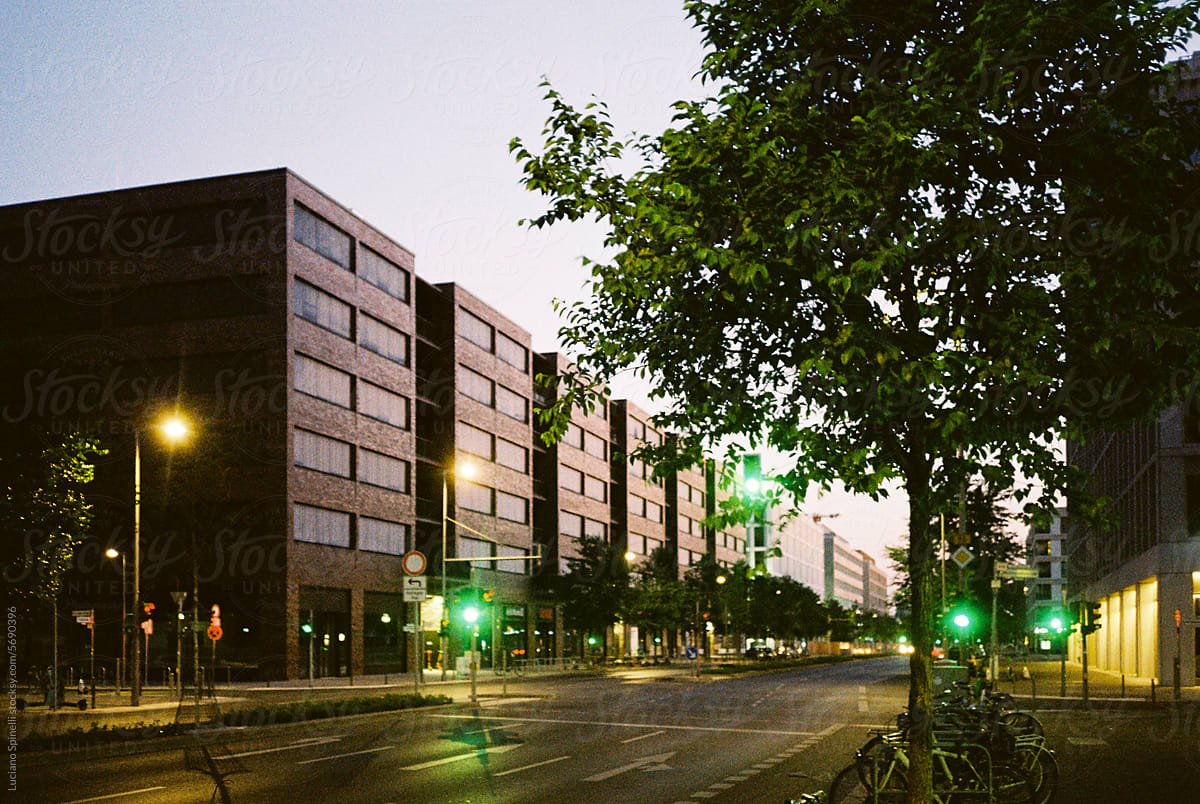 Urban scenario: similar modern brown buildings in a row and street