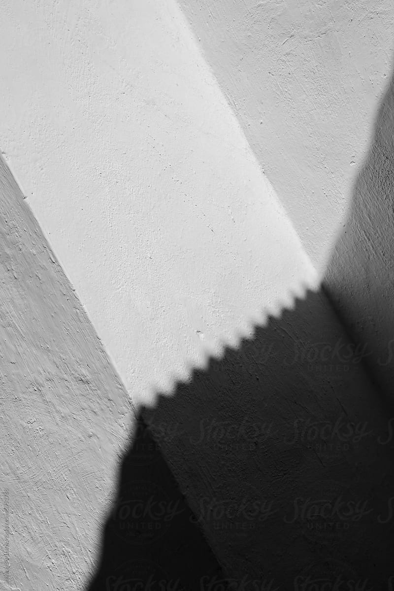 white textured wall with a shadow