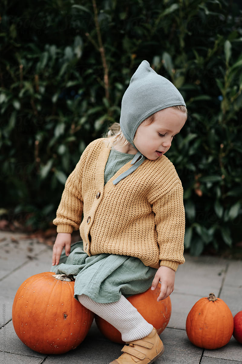 Adorable pretty little blond girl in autumn fashion