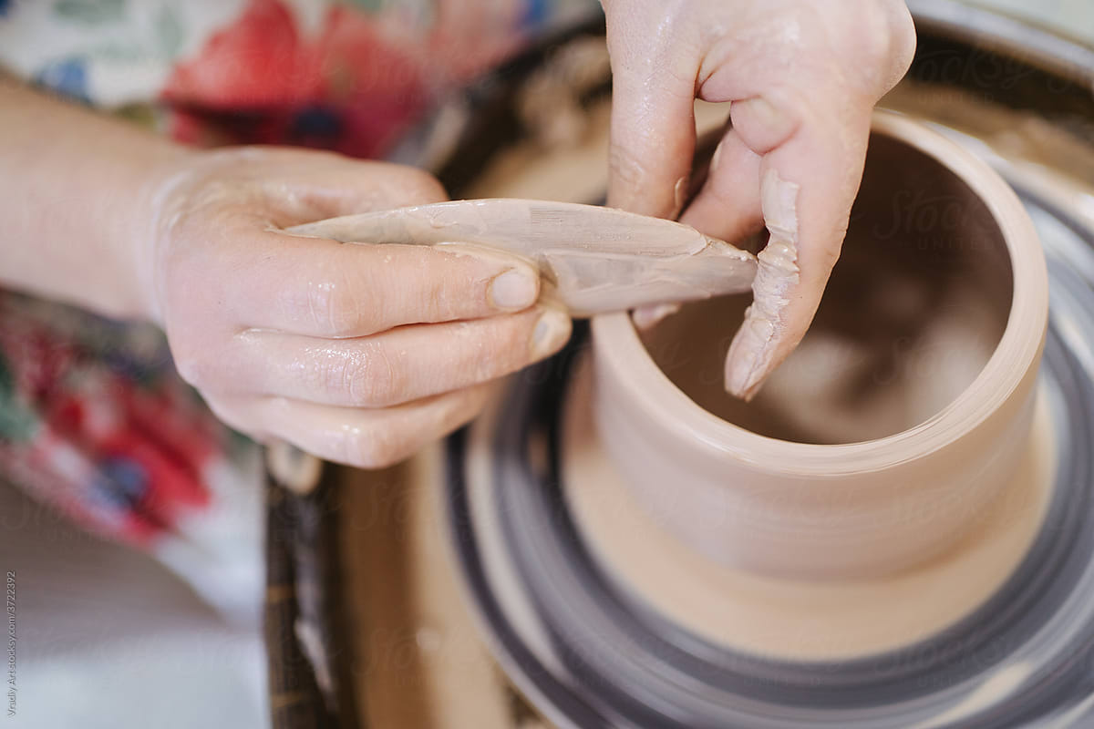 Potter creating a pot on the wheel