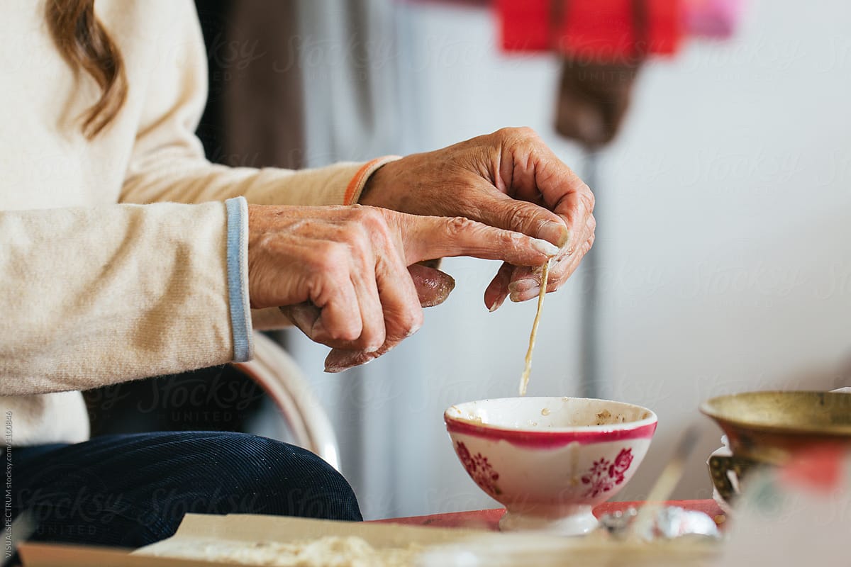 Hands of Senior Woman Making Natural Incense Stick at Home