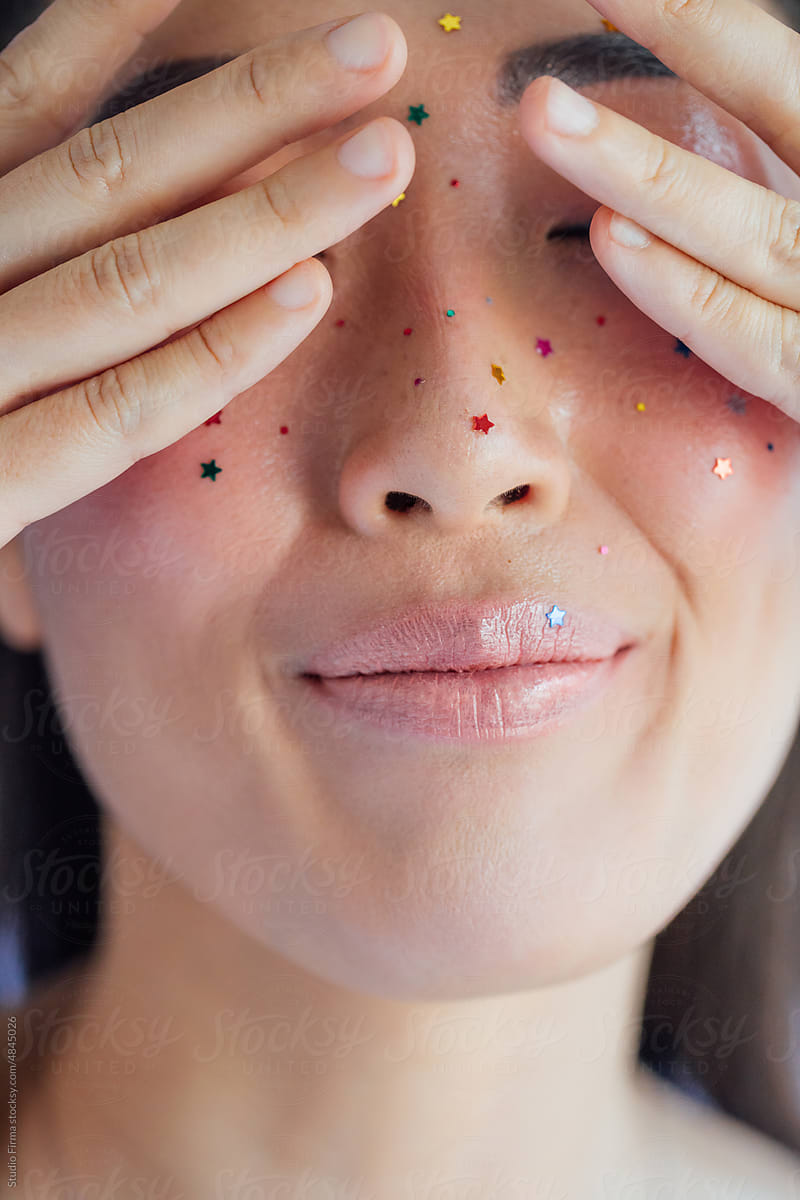 Beautiful Woman with Glitters on Her Face