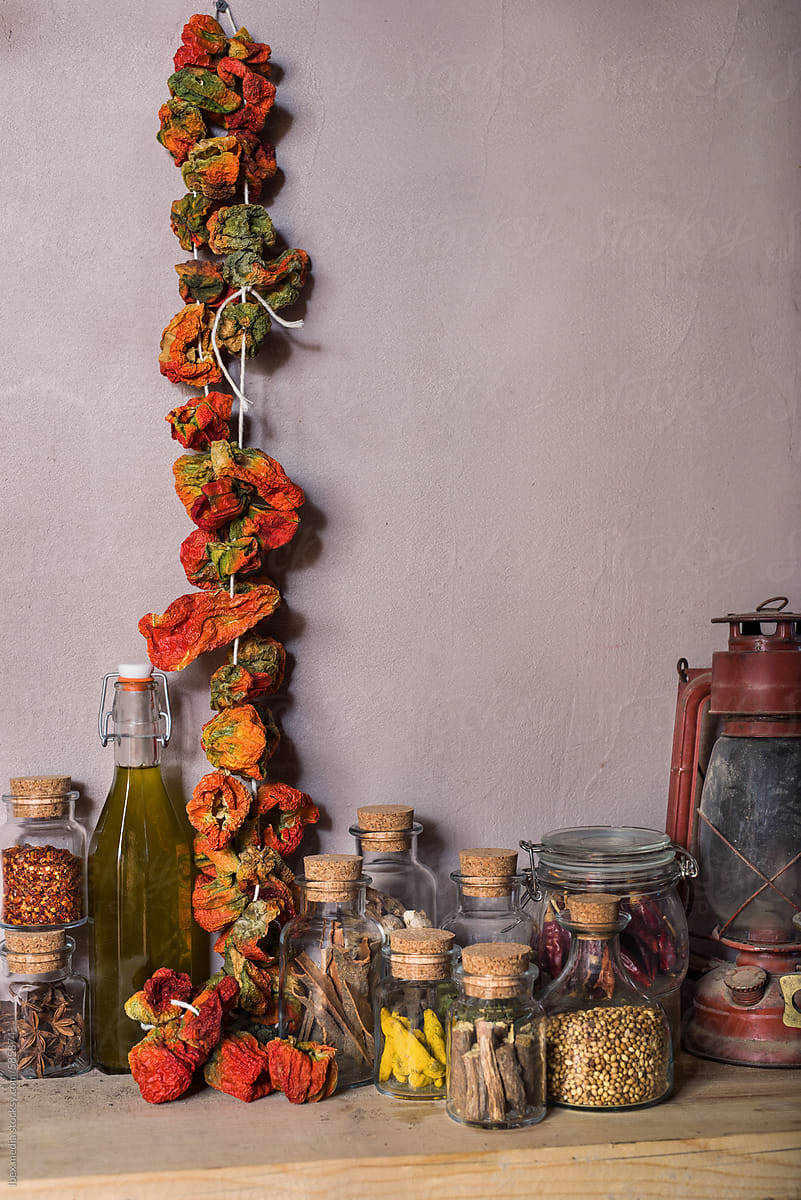 Glass jars with spices and whole dried chili