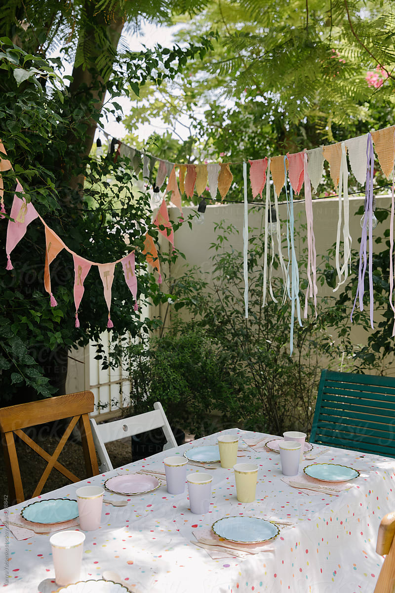 A table decorated for a birthday party in the garden