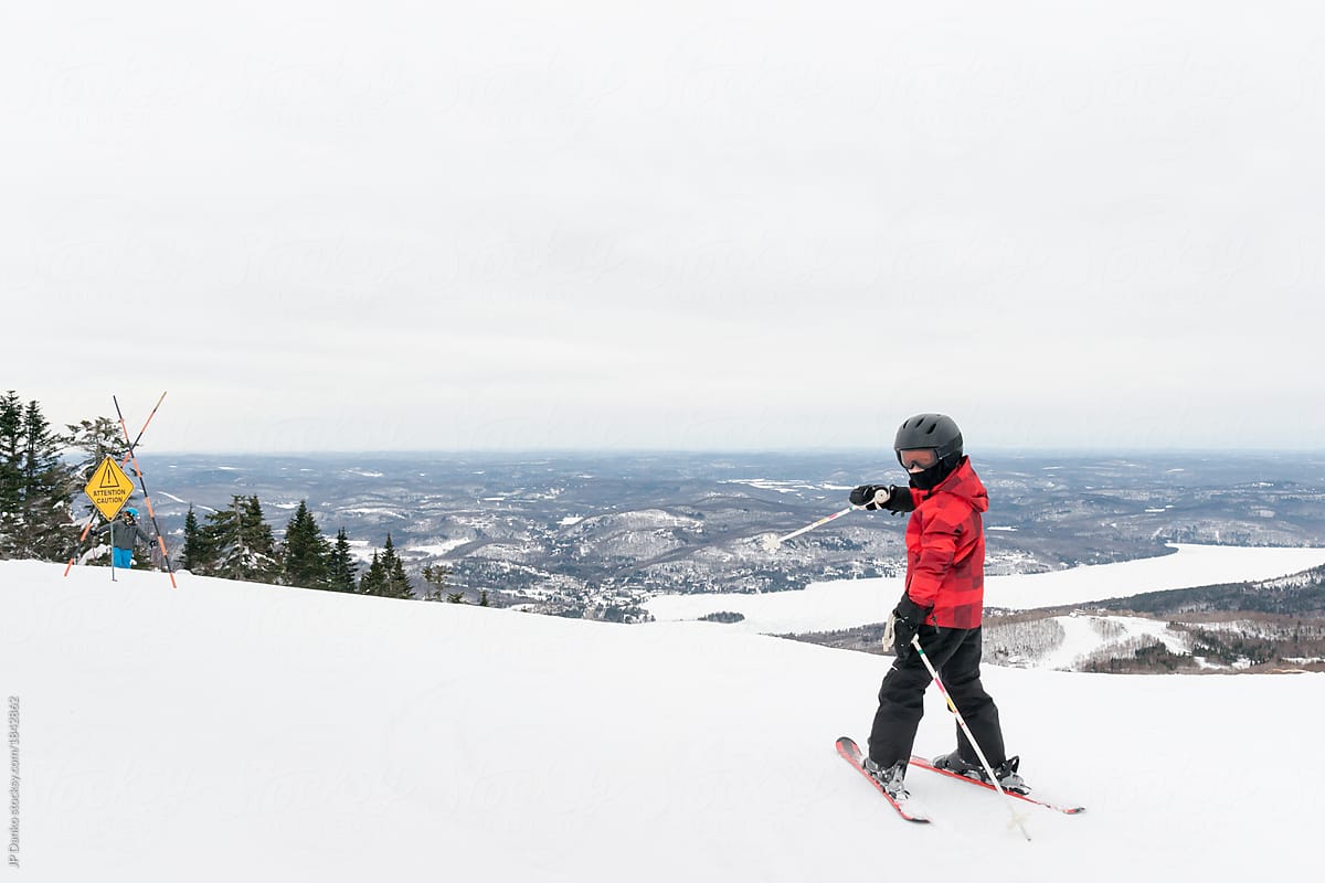 Boy proudly points out height of mountain he will ski down