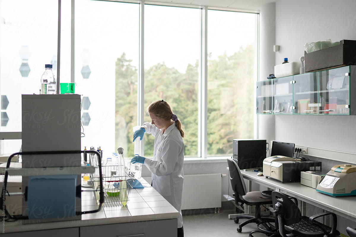 Scientist Working In Modern Luminous Laboratory