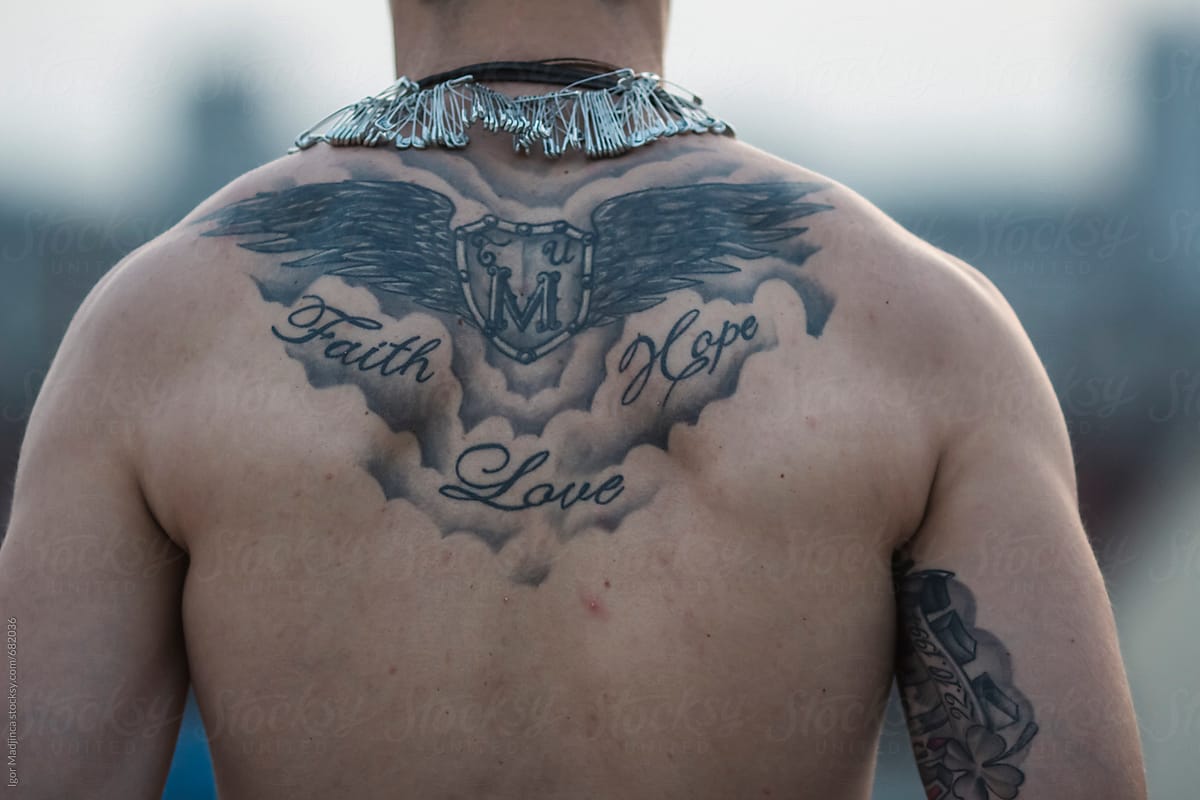 faith,hope,love, tattooed back of strong men