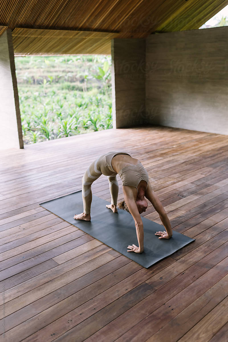Adult woman doing yoga in yoga studio