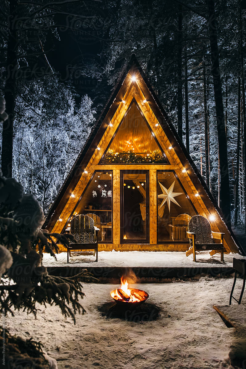 Cozy a-frame house at night