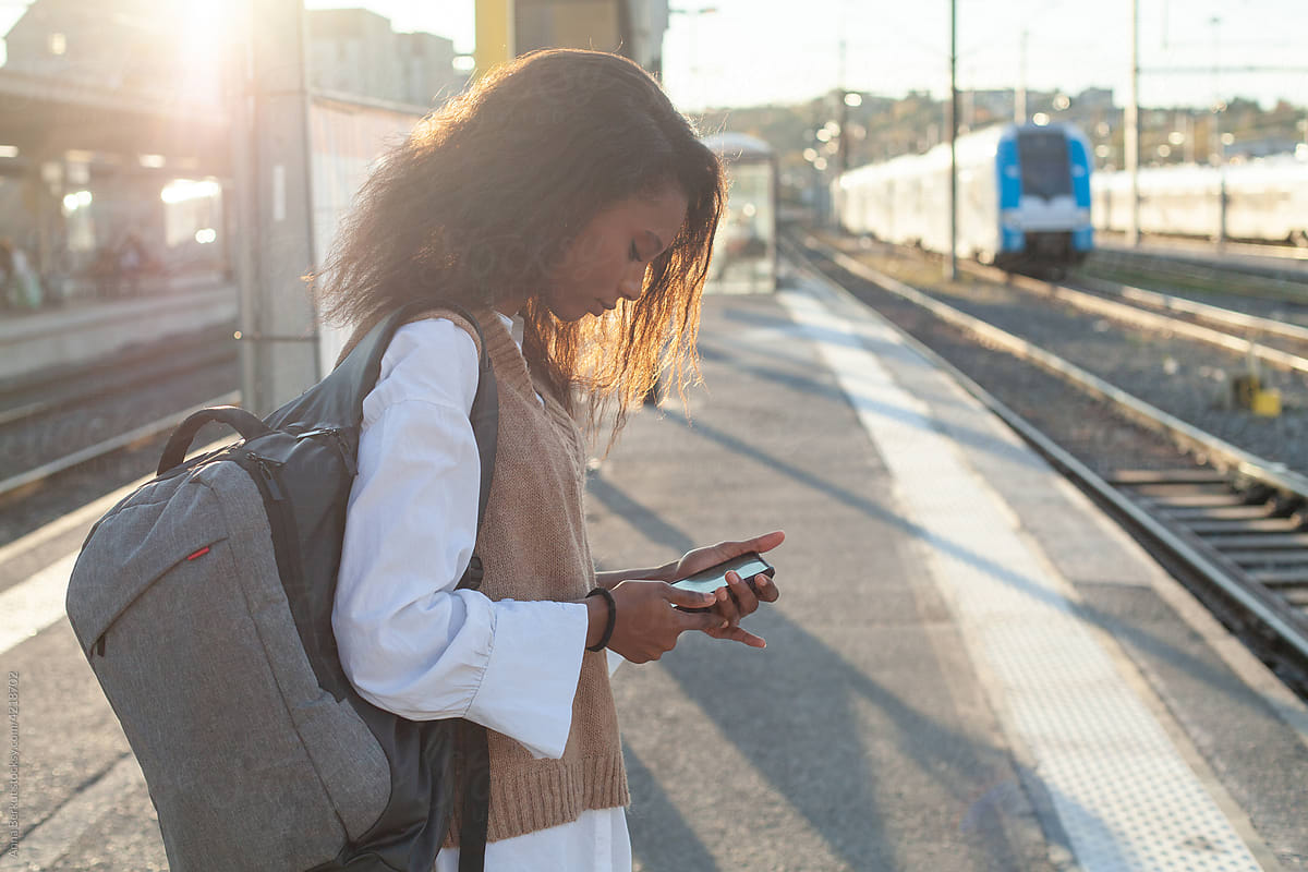 transport, passenger on train station using smartphone