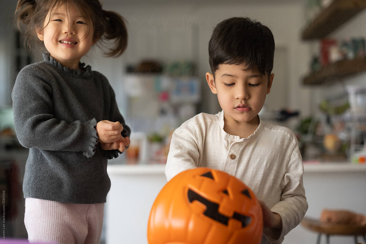 Happy kids with Halloween candy