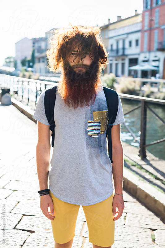 Long beard redhead man portrait in the city