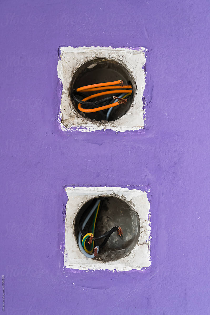 Electric wire detail on a wall socket