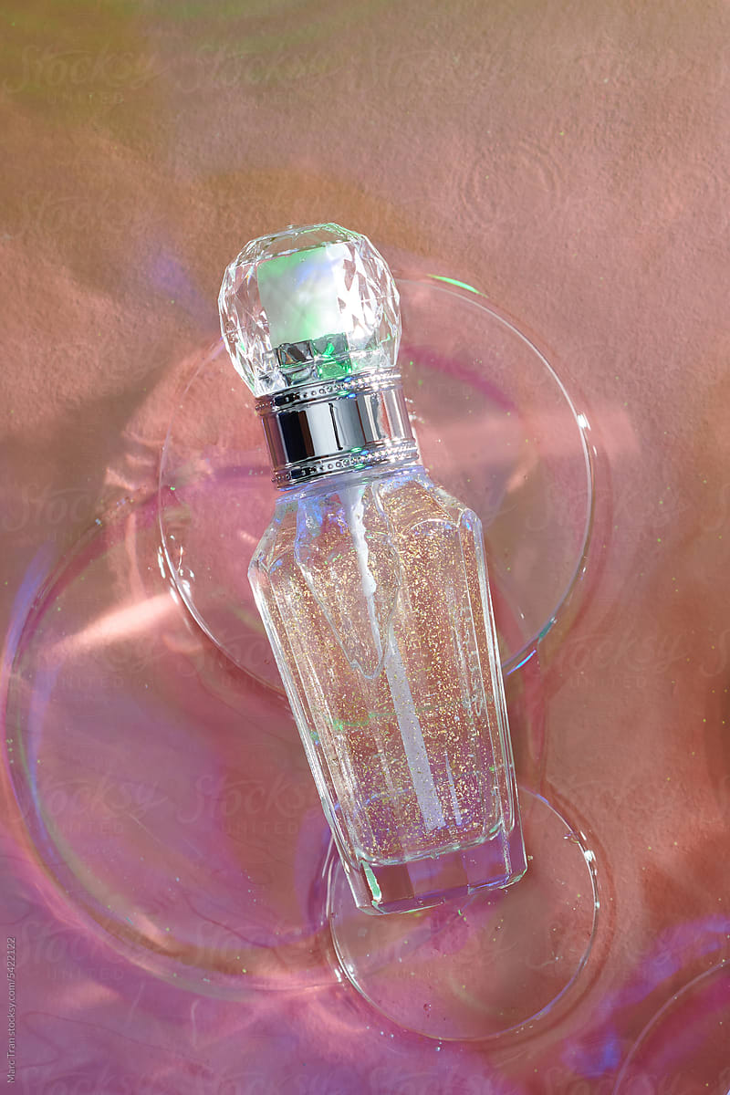 Two luxury glass bottle for cosmetic lies on water