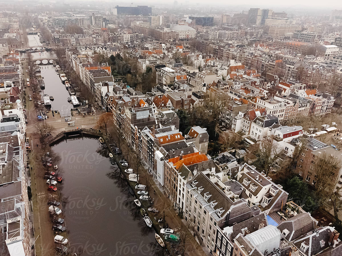 Panorama of watered canal surrounded by architectural buildings