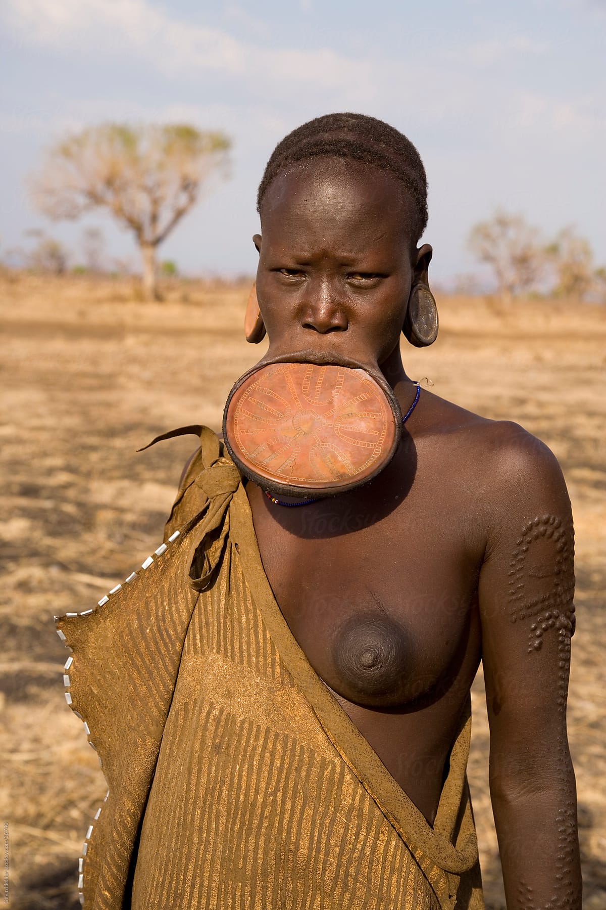 Mursi woman with clay lip plate, Mursi Hills, Mago National Park, Lower Omo Valley, Ethiopia, Africa