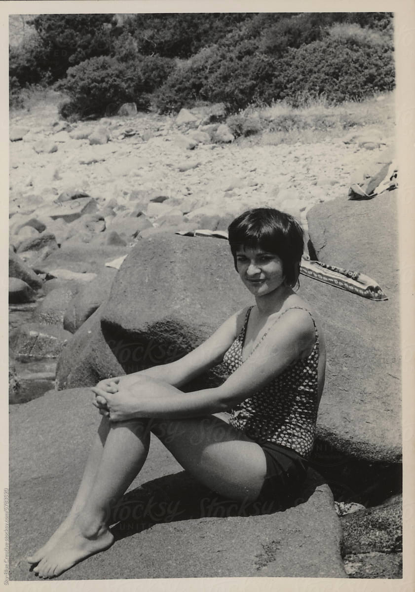 1974. Sunbathes on the rocks.