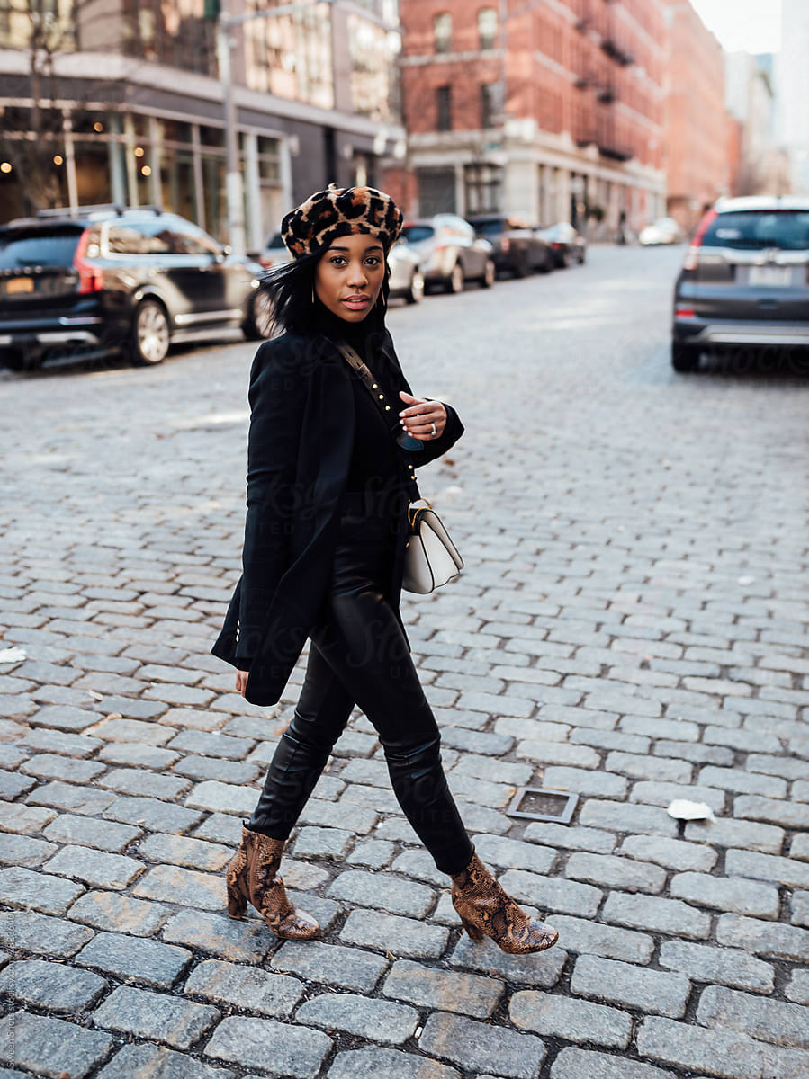 Woman wearing all black walking in New York City