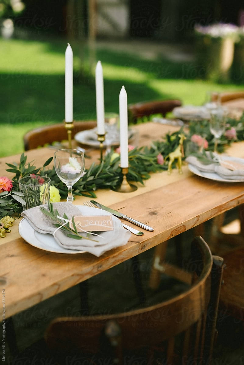 A bohemian looking wedding table with pastel colored styling