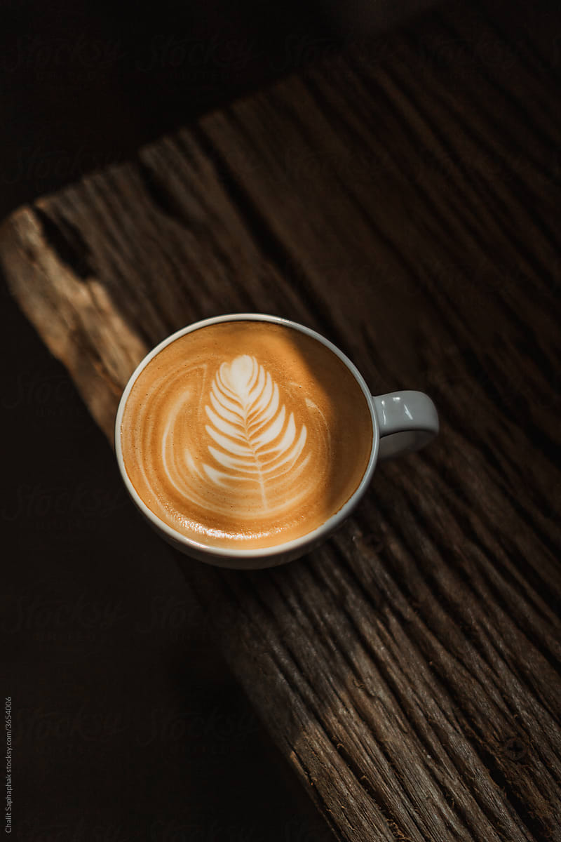 coffee latte art on wooden table