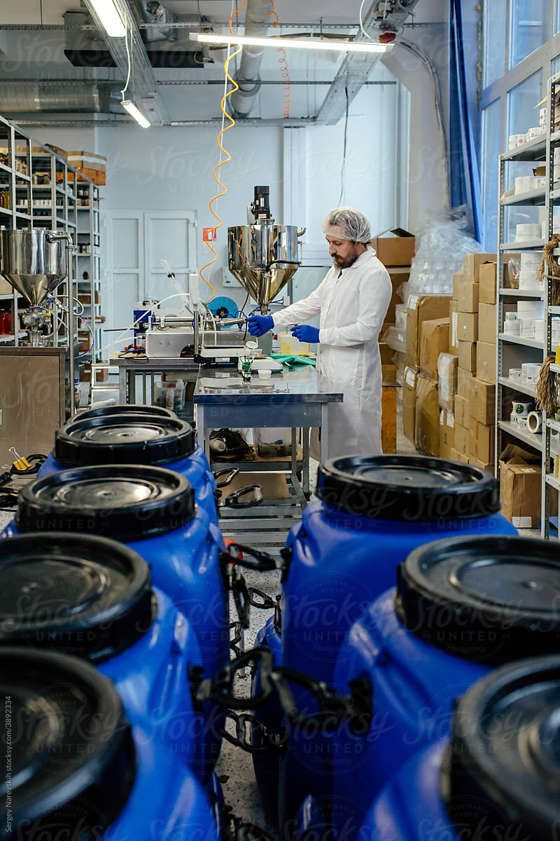 Male chemist working in lab at cosmetics plant
