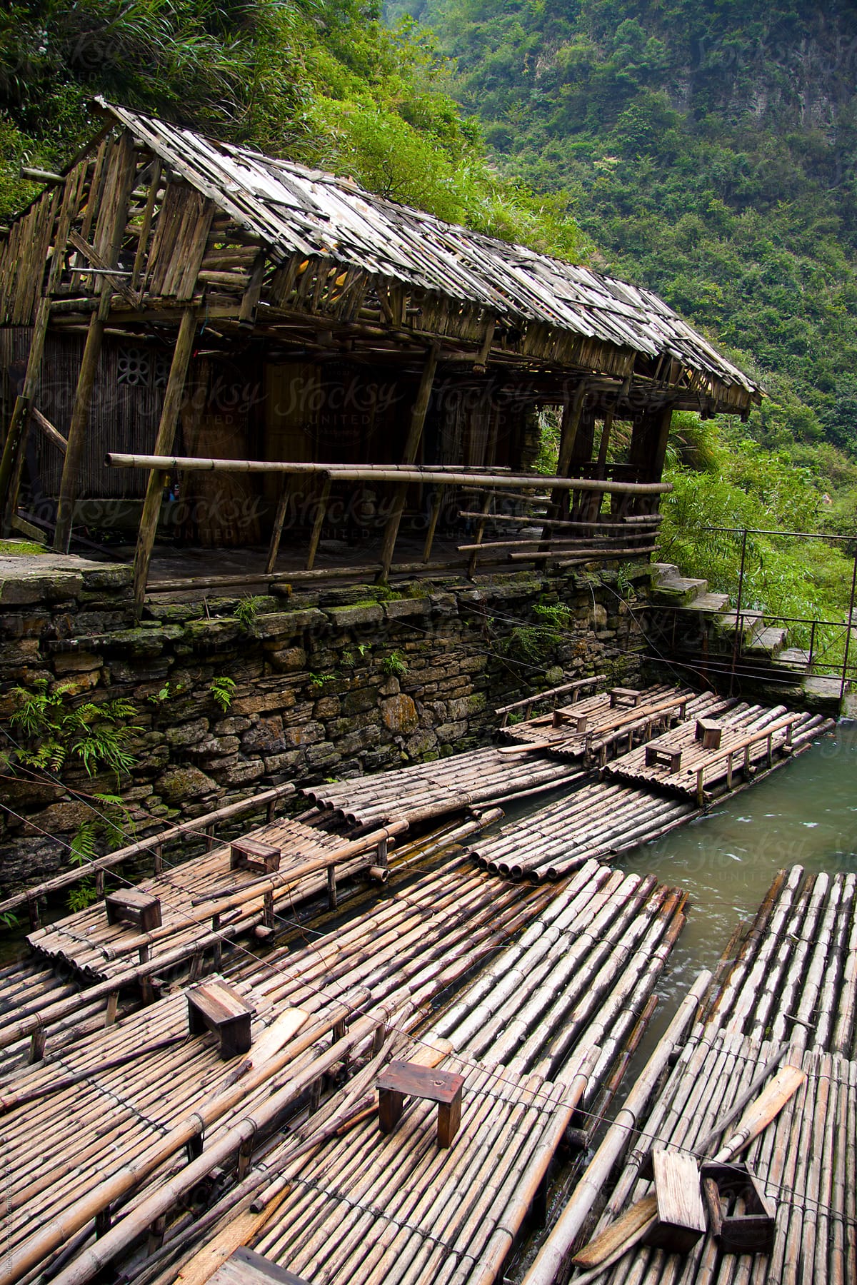 Shelter on the embankment and many rafts made of bamboo
