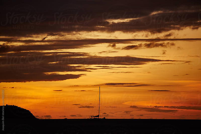 Sea Sunset with recreational sail boat