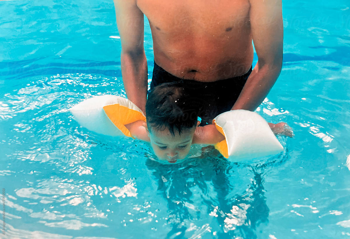 Father and son in the pool