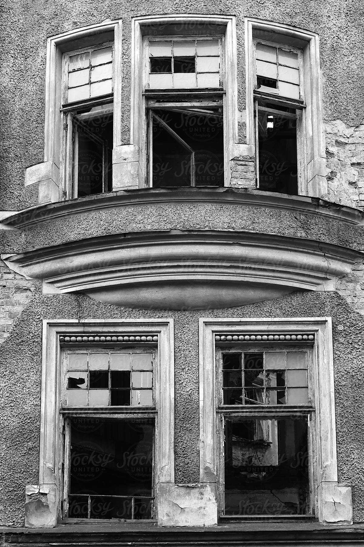 Smashed windows of abandoned building