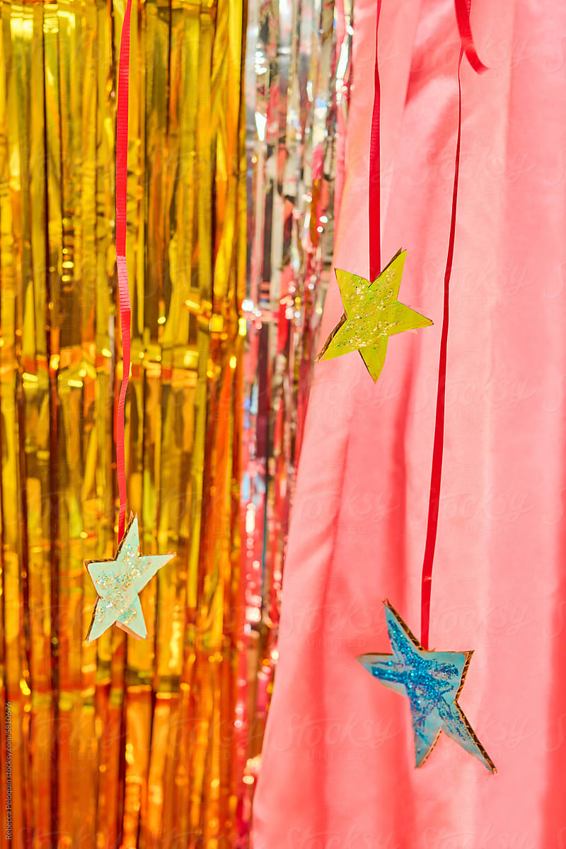 Painted Cardboard stars on metallic background fun party