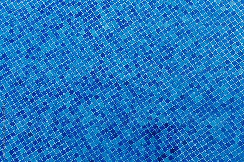 Textured background of multi toned blue tile