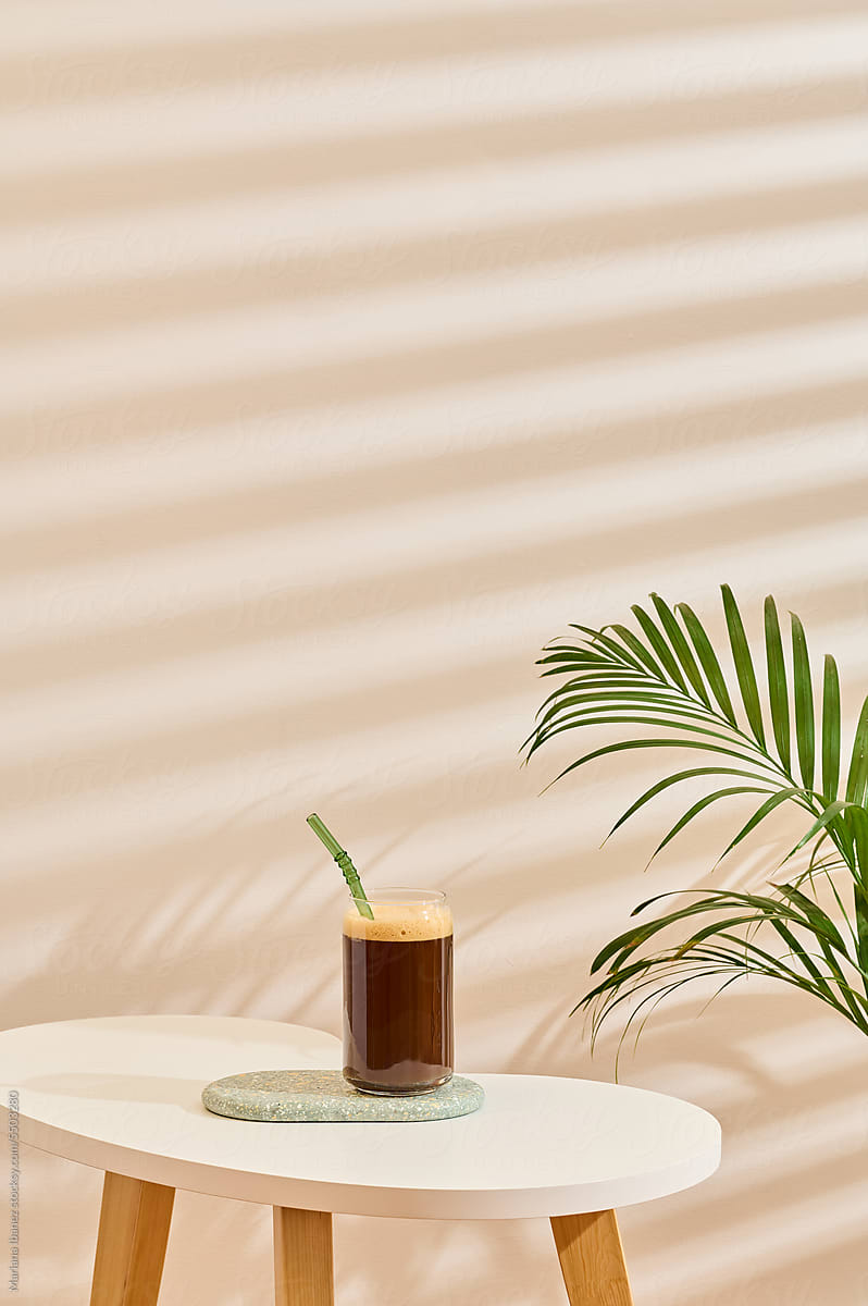 Iced coffee and plant on living room