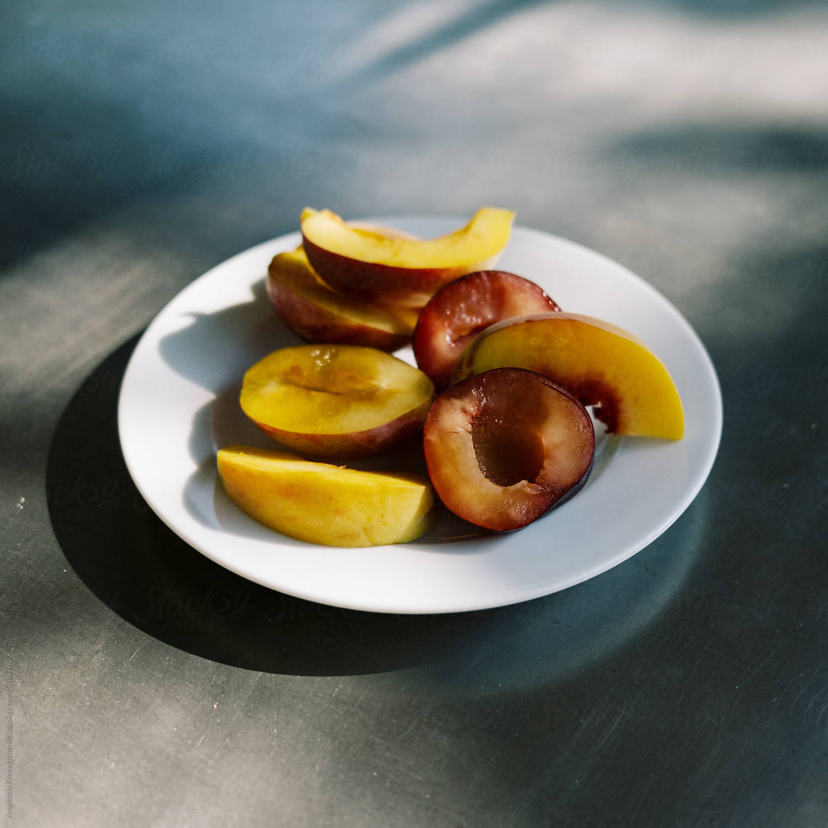 Sliced peaches in sunlight