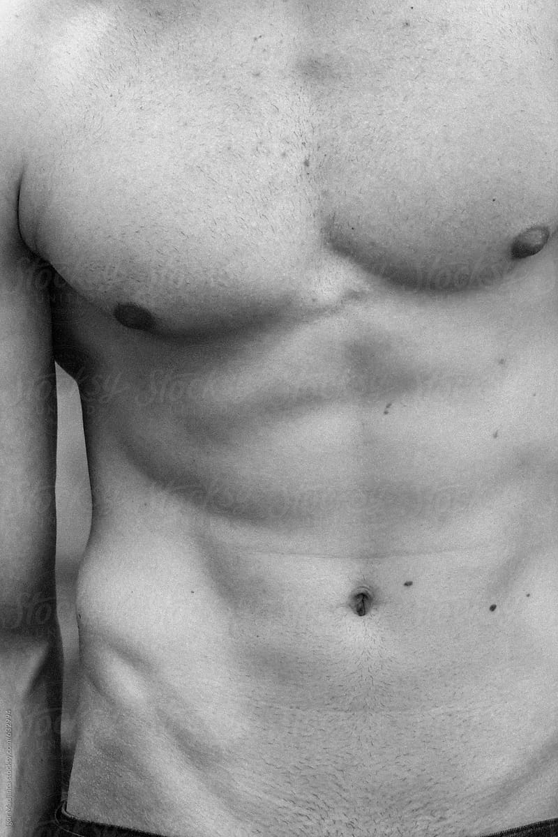 handsome man torso detail of a  muscular male abdomen