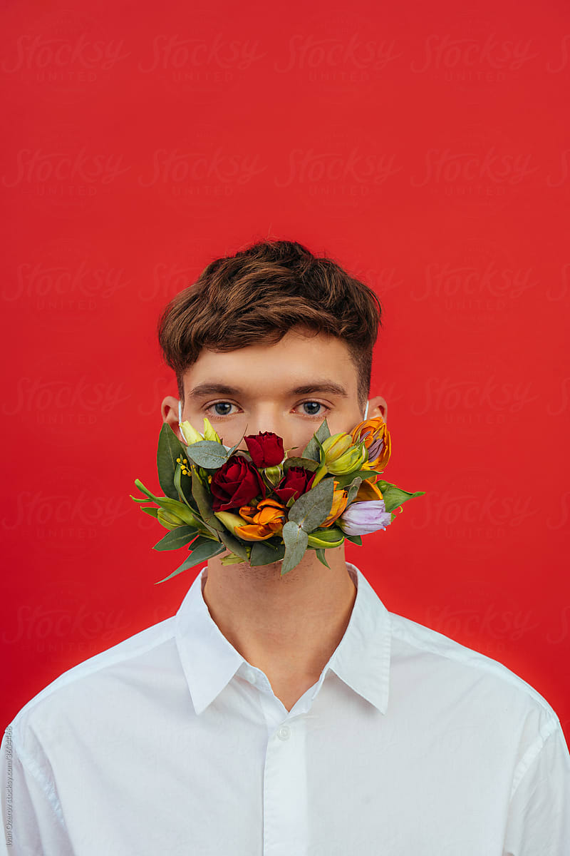 young man in flower mask