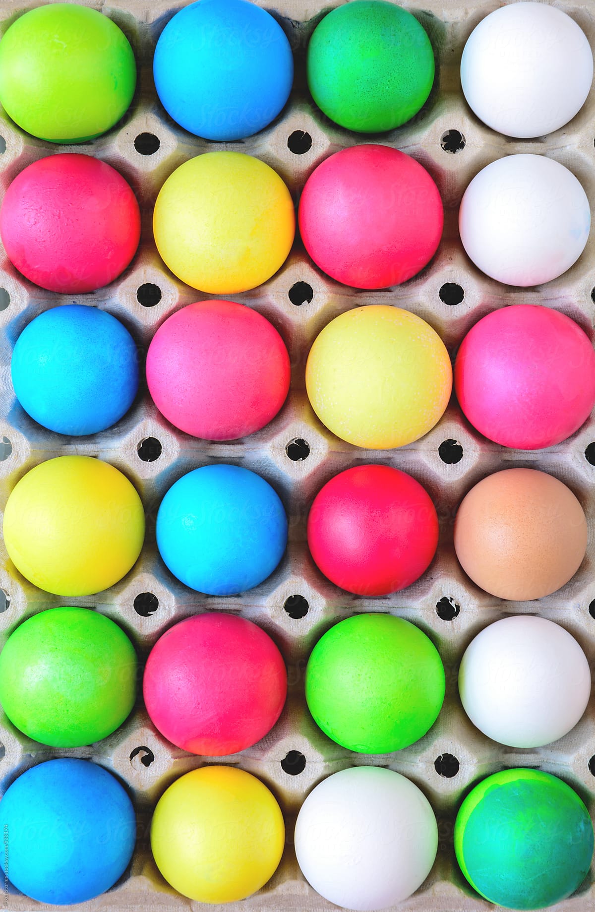 Colorful eggs for Easter in egg carton